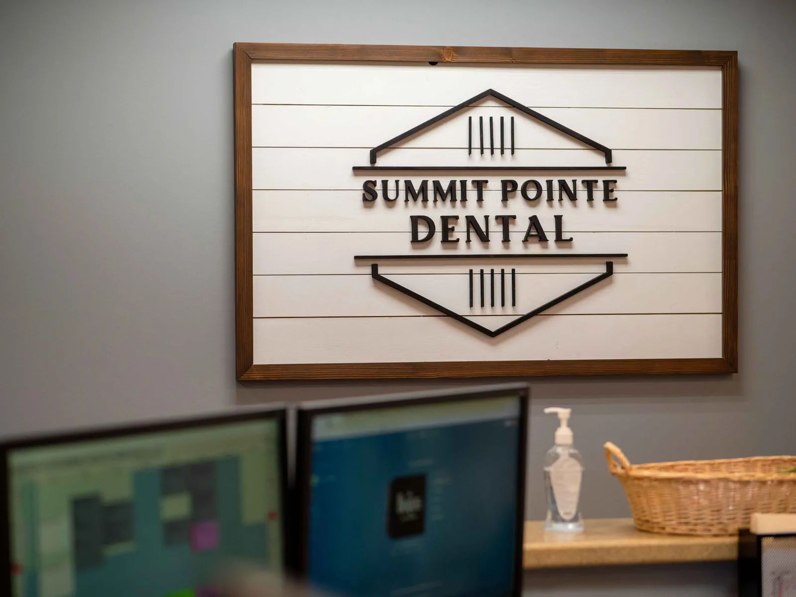 The Summit Pointe Dental sign above the check-in desk