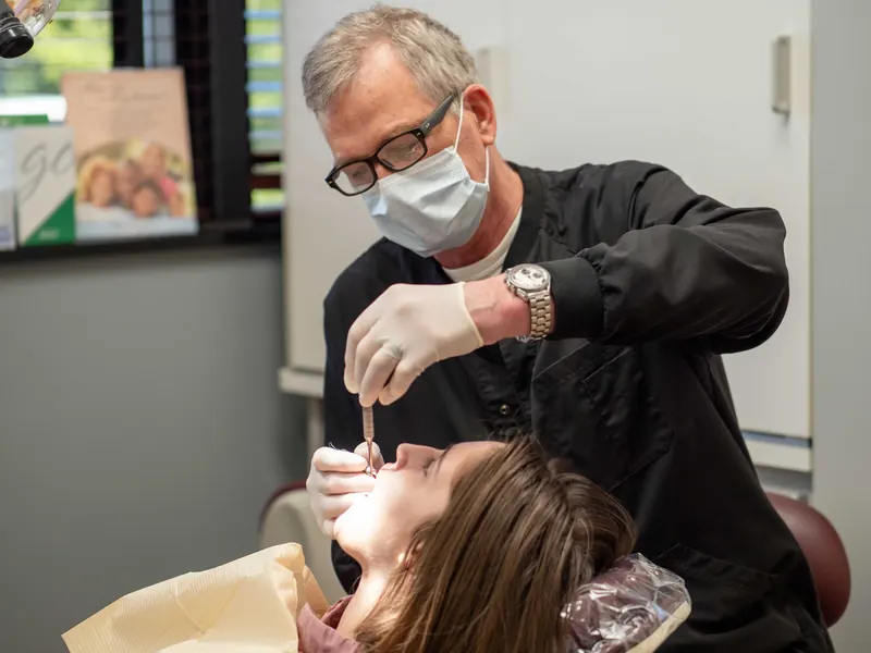 Dr. McFerran examining a patient