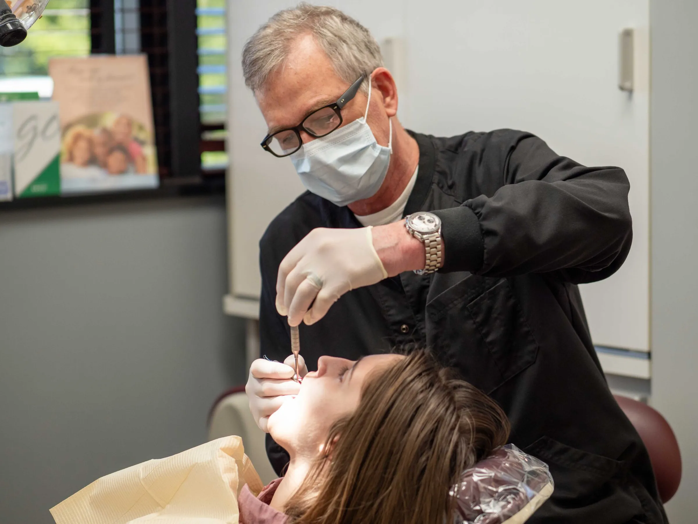 Dr. Mark McFerran examining a patient