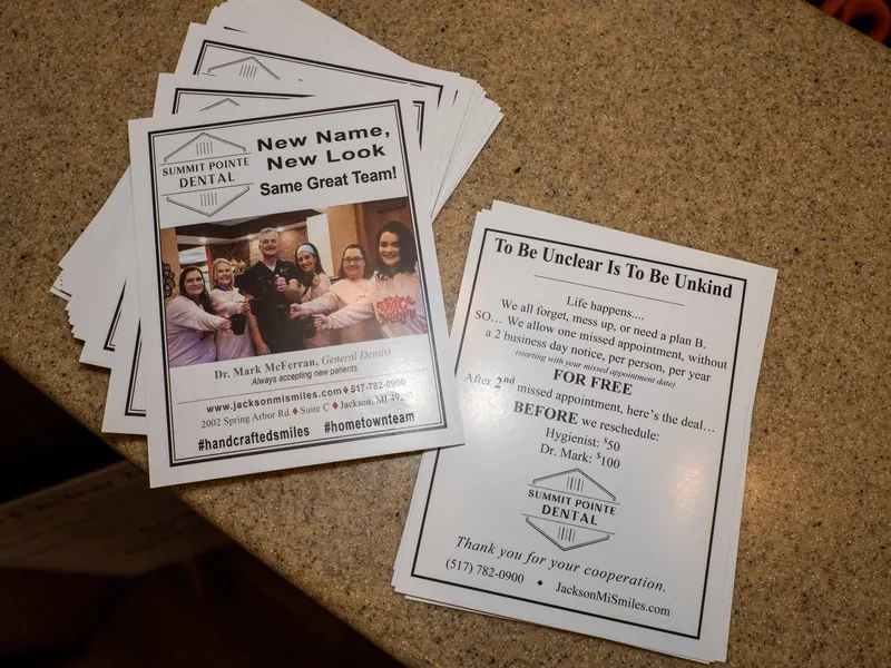 A flyer on the front desk reading New name, new look, same great team