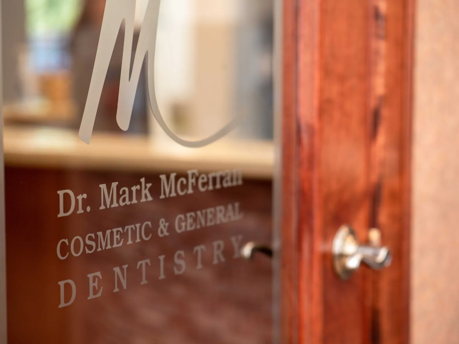 The etched glass sign for Dr. Mark McFerran, cosmetic and general dentistry