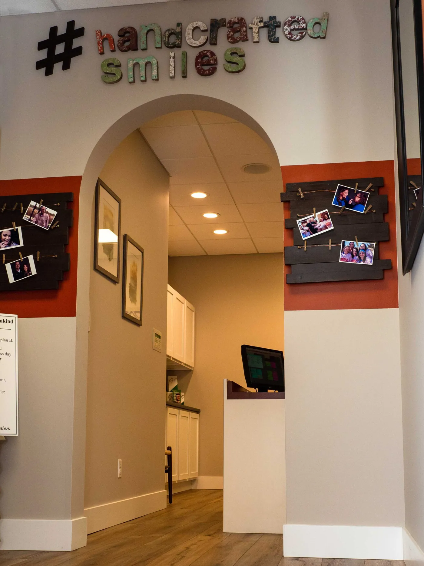 The #handcrafted smiles sign in the hallway at Summit Pointe Dental
