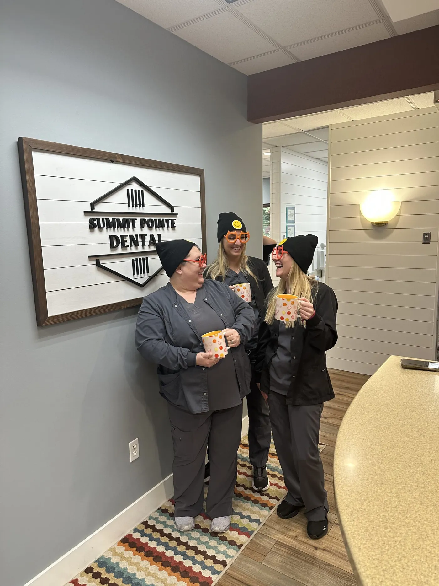 Team members having fun in the office in winter hats